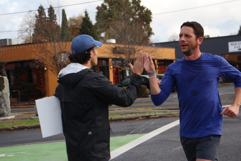 Mark Remy high five Nathan freeburg